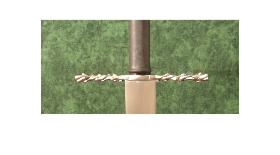 How do cross guards work on swords and daggers?