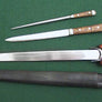 Wallace Ballock Dagger Set #199 four piece set with a large ballock style knife with a smaller by-knife, a pick and a scabbard that holds the other three items.