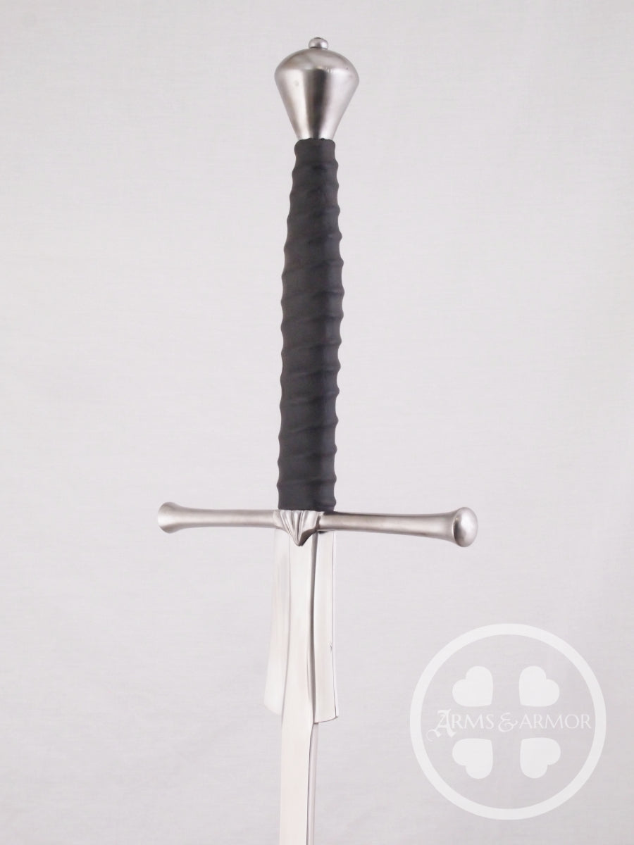 Sword with black handle on a light gray background