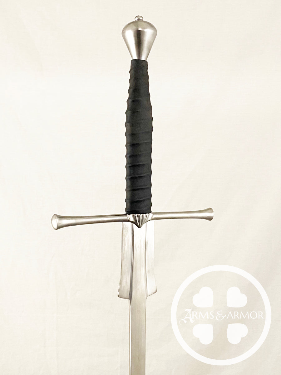 Sword with black handle on a light background, featuring a brand logo.