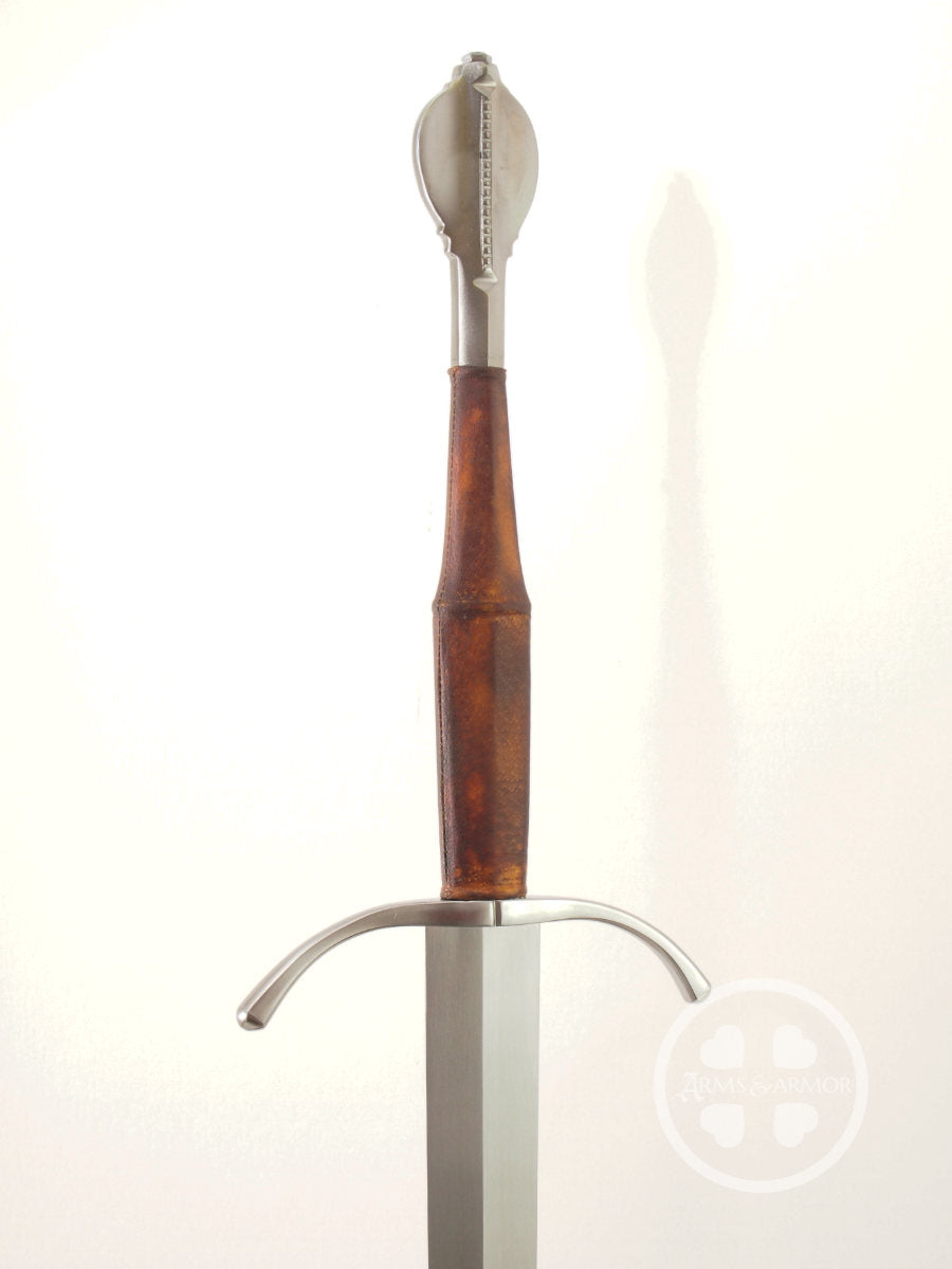 MId 15th Century long sword with type U pommel and slim grip three quarter view of hilt.