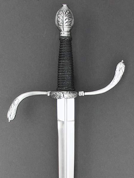 German Parrying dagger #196 with S shaped guard with ring and acanthus leaf detail and a wire bound grip.