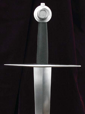 14th century Italian sword of type XV. Sword hilted with classic wheel and straight guard on single handed tapering blade.